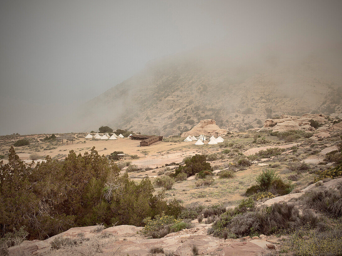Rummana camping ground surrounded by clouds, Beduin tents at Dana nature reserve, UNESCO world heritage, Dana, Jordan, Middle East, Asia