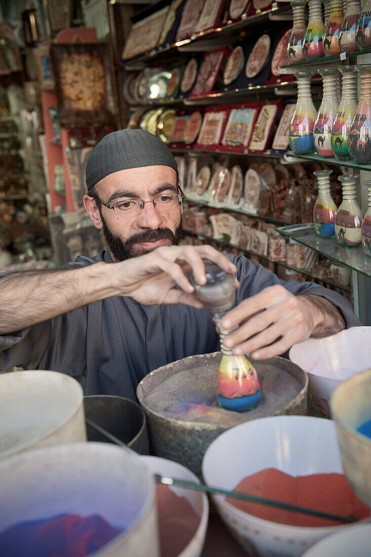 Sand artist at work for travel souvenir, capital Amman, Jordan, Middle East, Asia