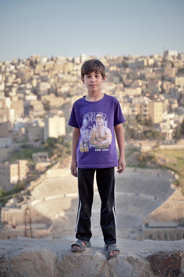 Jordanian boy posing in front of Roman Theatre, capital Amman, Jordan, Middle East, Asia