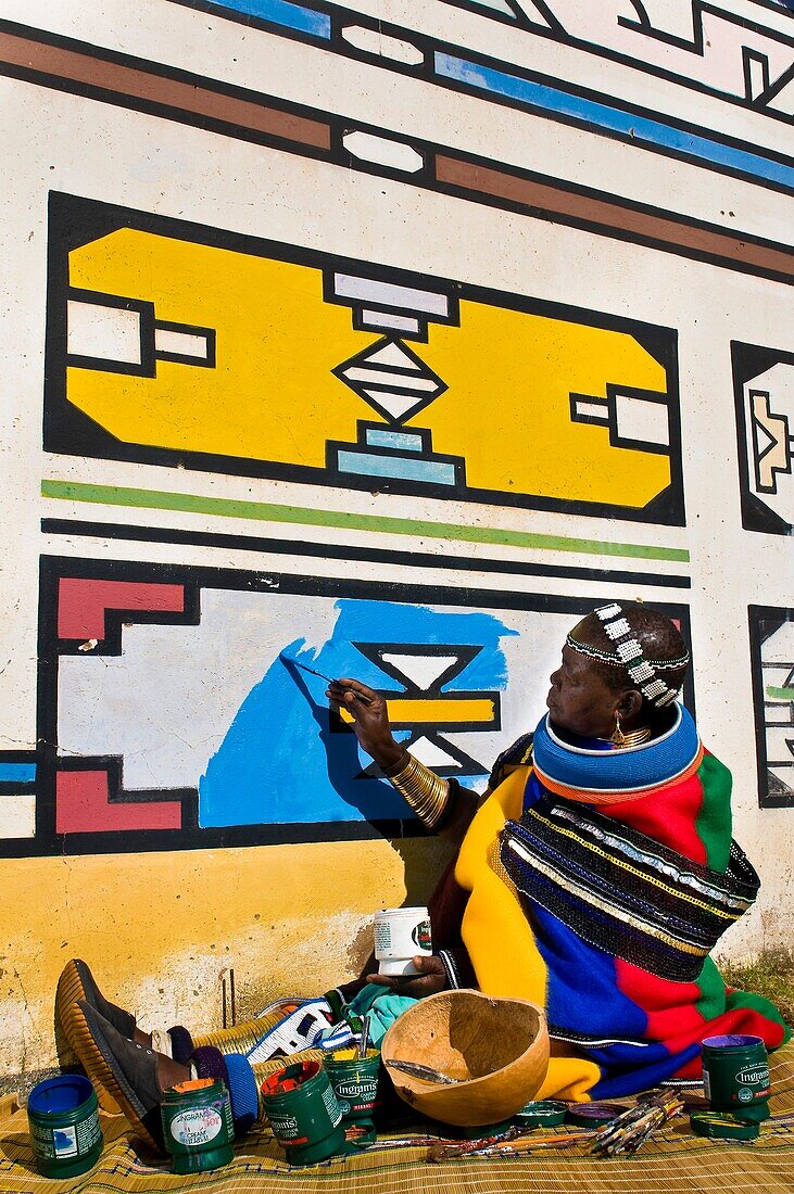Africa, South Africa, Mpumalanga Province, KwaNdebele, Ndebele tribe, Mabhoko village, the artist Francina Ndimande painting her walls