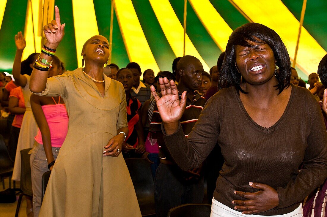 Africa, South Africa, Gauteng Province, Johannesburg city, Soweto (South Western Township), Orlando West Quarter, believers in tears during a messa in a gospel church