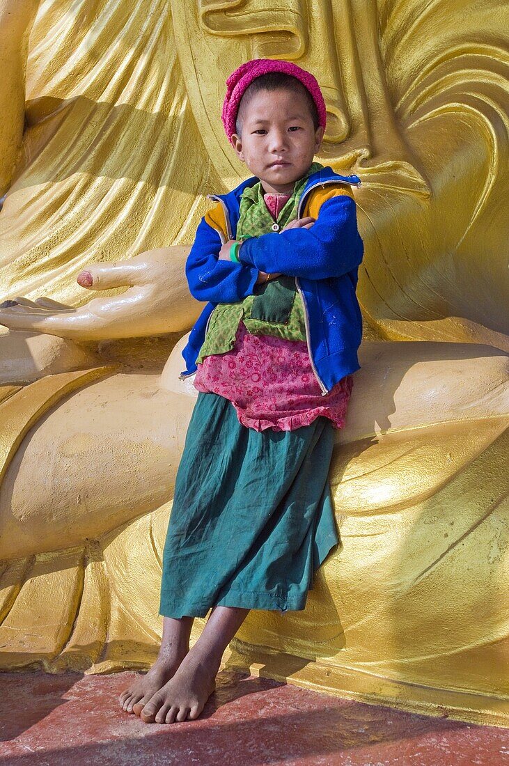Myanmar (Burma), Sagaing State, Leshi, Naga children on the feet of the Great Buddha
