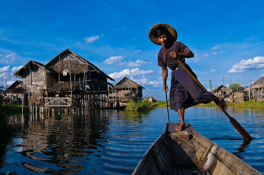 Myanmar (Burma), Shan State, Inle lake, Pauk Par village, the fisherman U Thone on his canoe, only way to move from one stilt house to the other