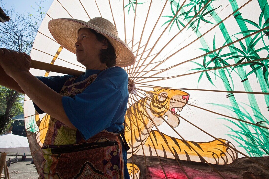 Thailand,Chiang Mai,Borsang Umbrella Village,Workers Carrying Giant Umbrellas