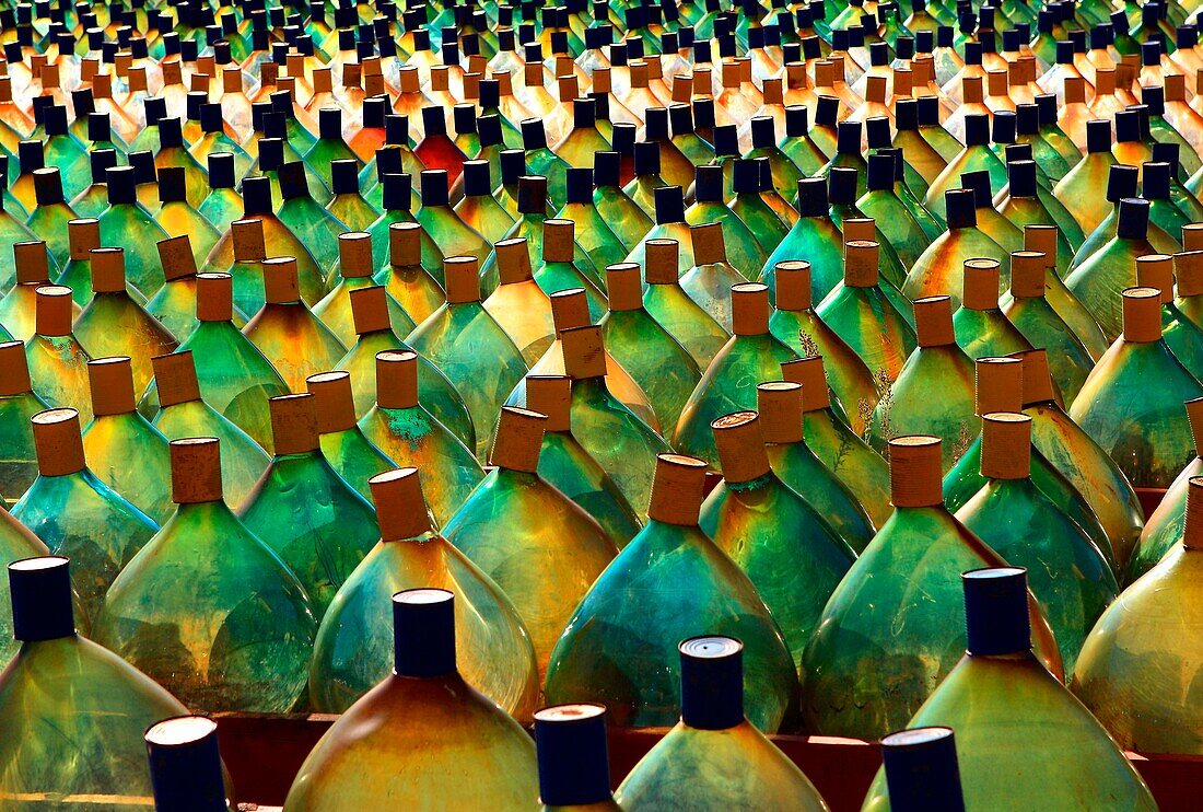 Alignment of bottles, glass carboys, graphic effect
