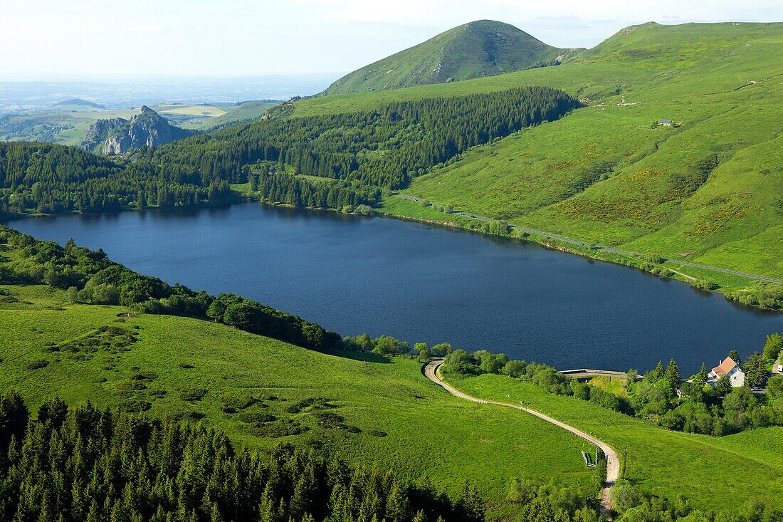 France, Puy de Dome (63), Lake Guery, Monts Dore Massif in the distance and rocks Tuilières Sanadoire, Regional Natural Park of Auvergne Volcanoes (aerial view)