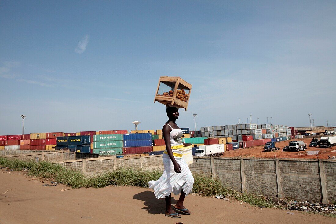 African woman carrying a load on her head. Lome. Togo.