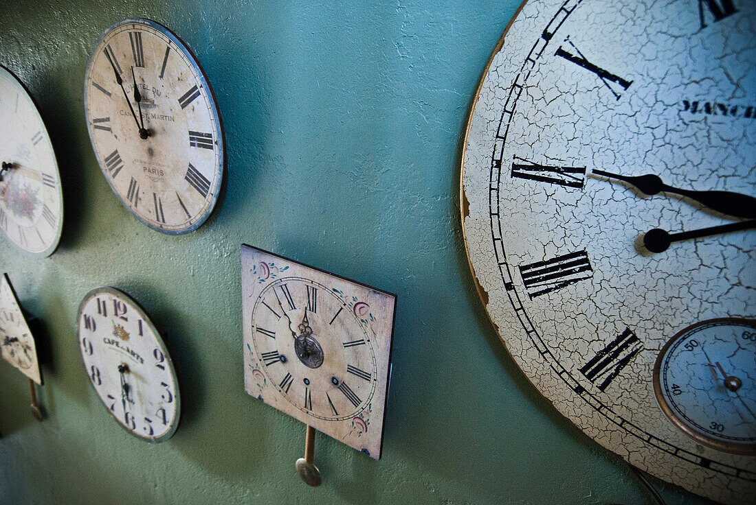 Assorted Old Clocks on Wall