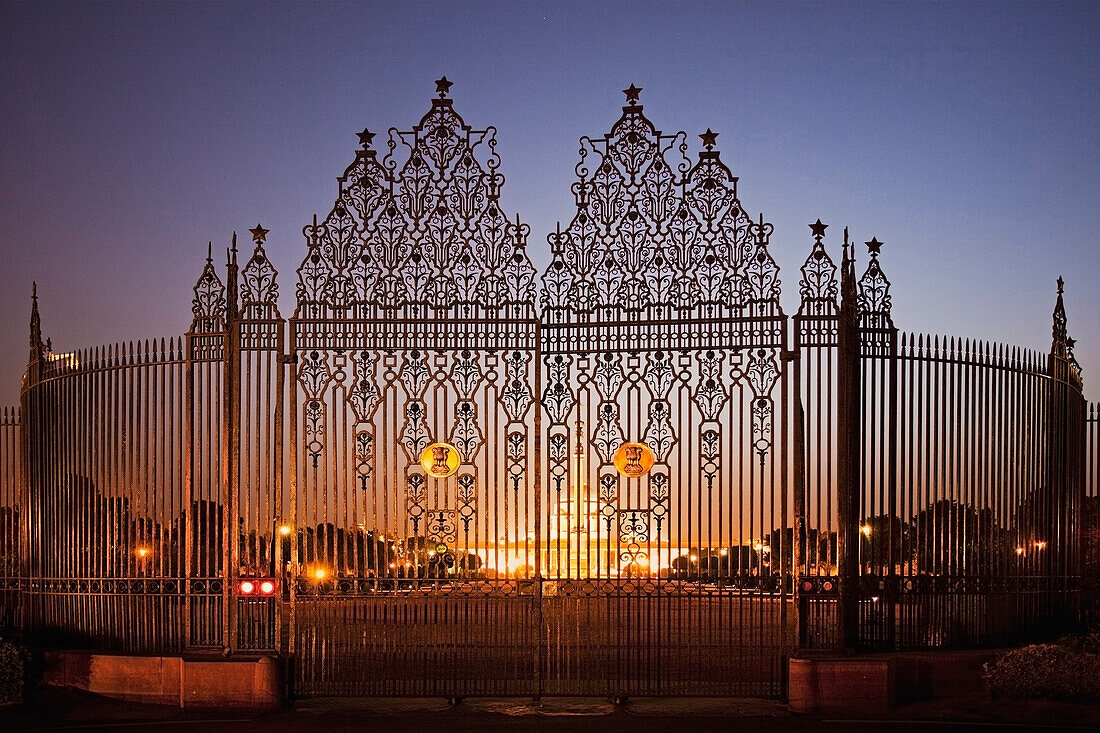 Gates to the Presidential Palace at dusk. Historic building, Rashtrapati Bhavan. Decorative ironwork gates. Lights. Lit up., Presidential Palace, Punjab, New Delhi, India