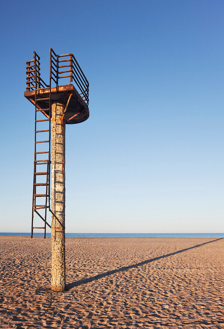 A rusting lifeguard tower on an empty beach early in the morning near Almeria, Spain., Almeria, Spain / Beach and Lifeguard Tower