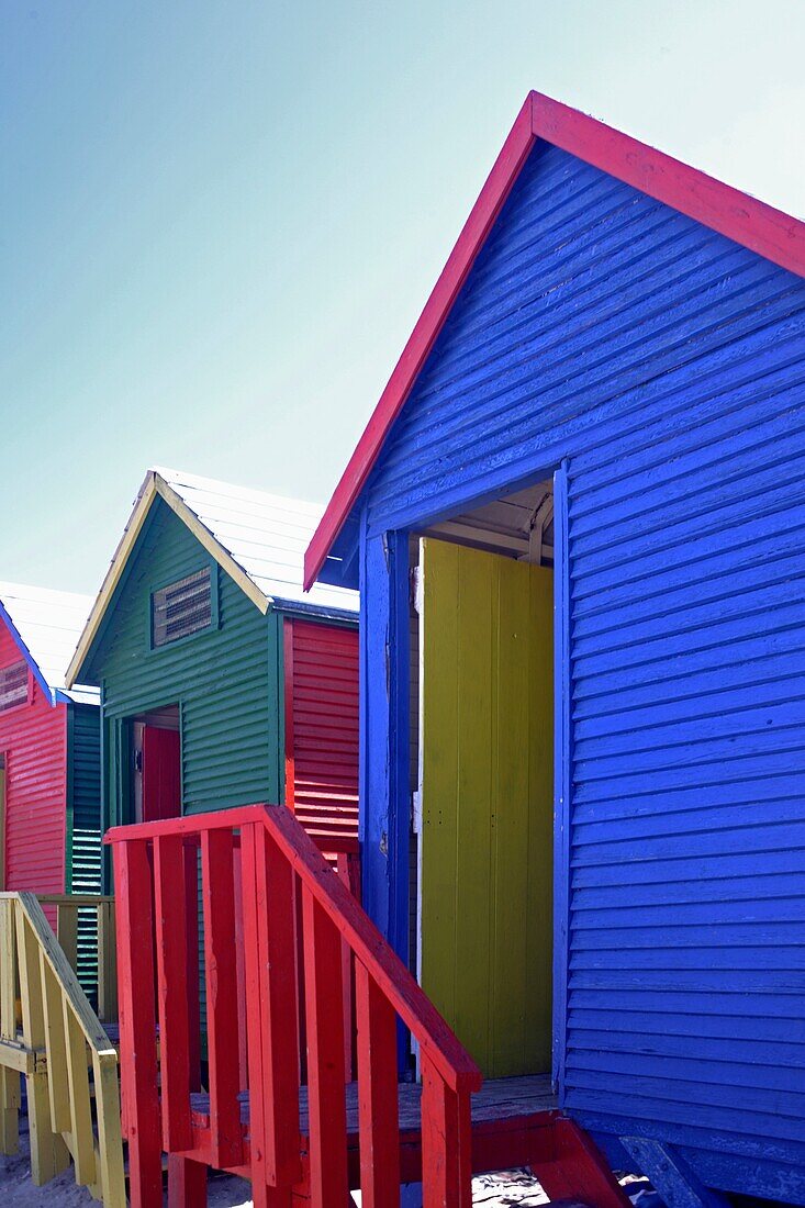 Colorful beach huts at the sandy beach of St  James with blue sky, False Bay near Cape Town, South Africa