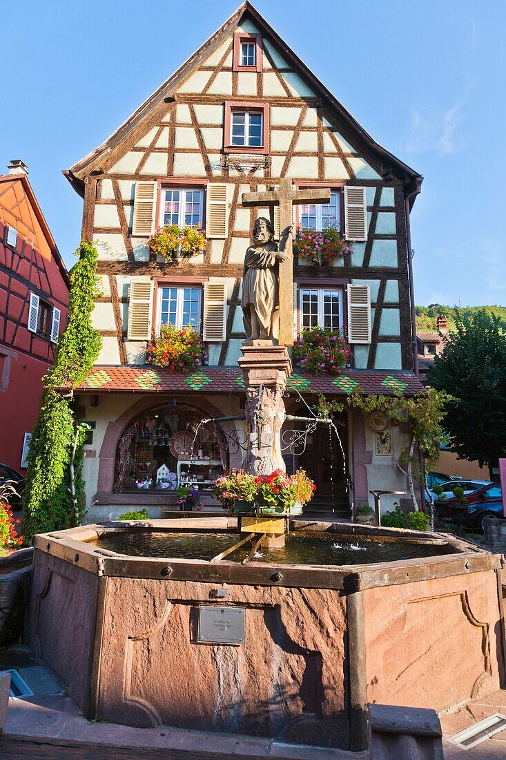 adorned , Alsace , architecture , building , color image , construction , day , Europe , fountain , frame , France , Haut-Rhin , house , Kaysersberg , outdoor , saint , statue , timber , timbered , vertical , V04-1585447 , AGEFOTOSTOCK 