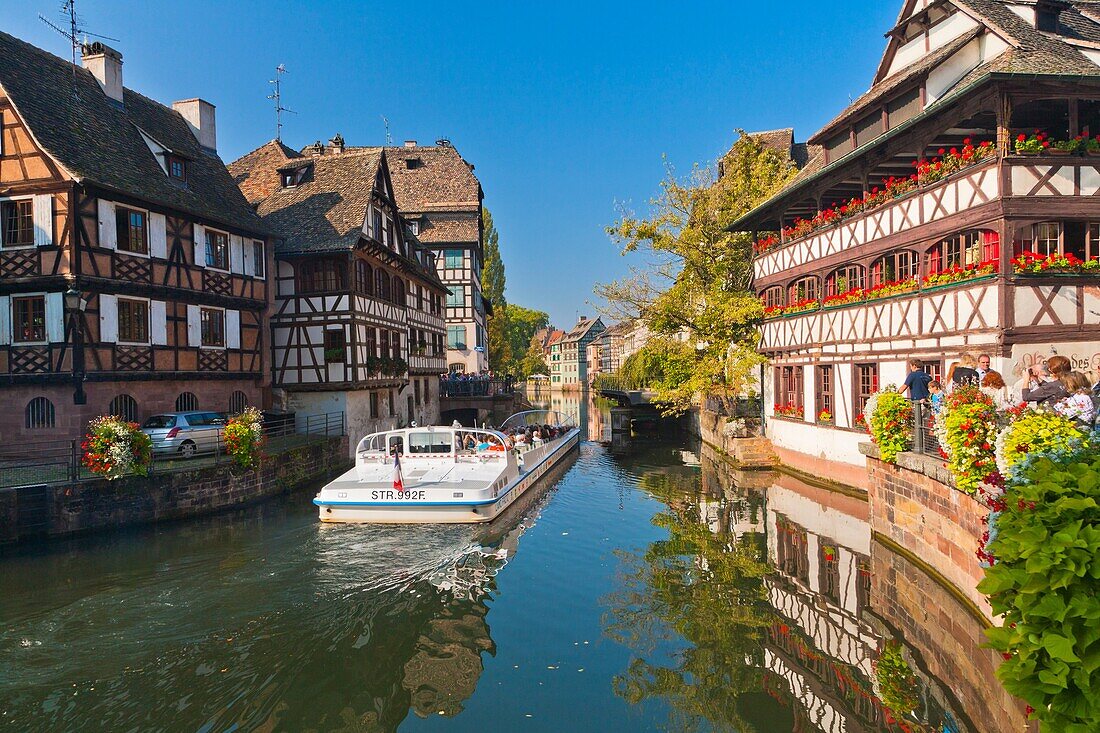 Sightseeing boat on a canal in Strasbourg, Alsace, France, Europe