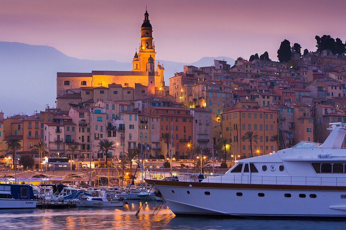 Harbor and the Basilique St-Michel-Archange in Menton at dusk, Provence, France, Europe