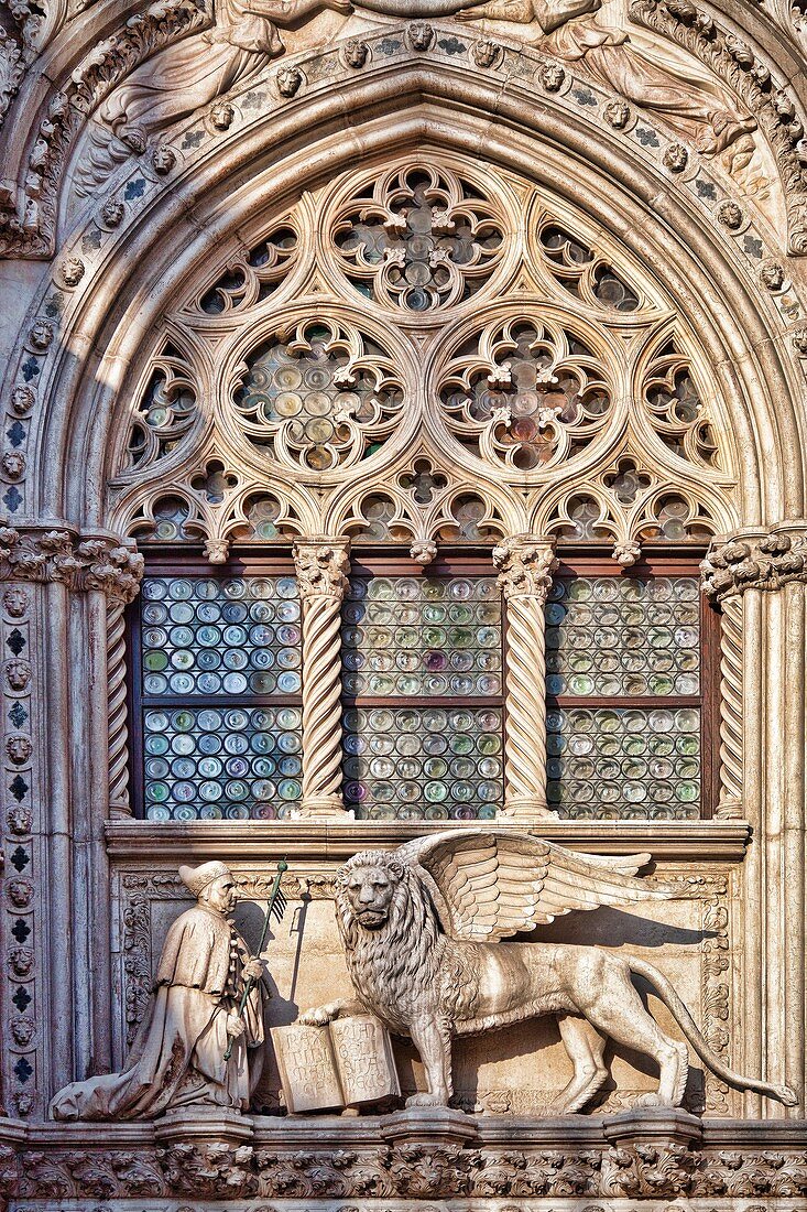 The Winged Lion and the Doge Francesco Foscari statues on the top of Porta della Carta Gate, Palazzo Ducale, Venice, Italy
