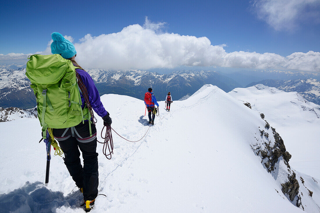 Three mountaineers descending, Piz Palue, Grisons, Switzerland