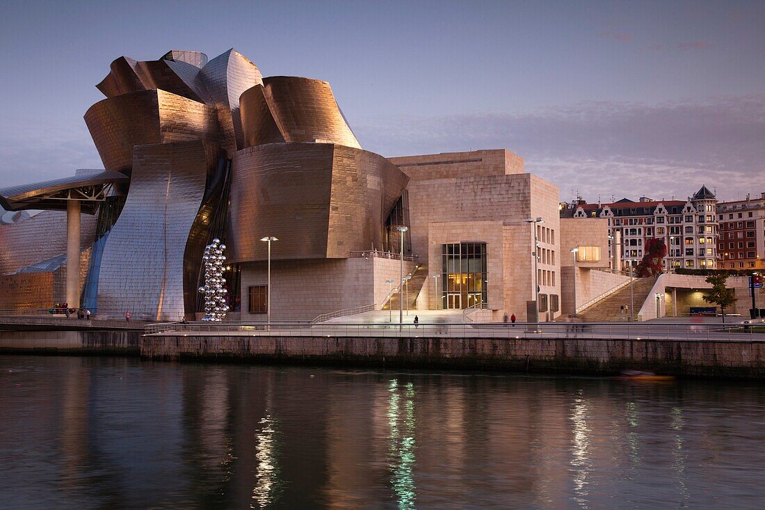 Spain, Basque Country Region, Vizcaya Province, Bilbao, The Guggenheim Museum, designed by Frank Gehry, dusk