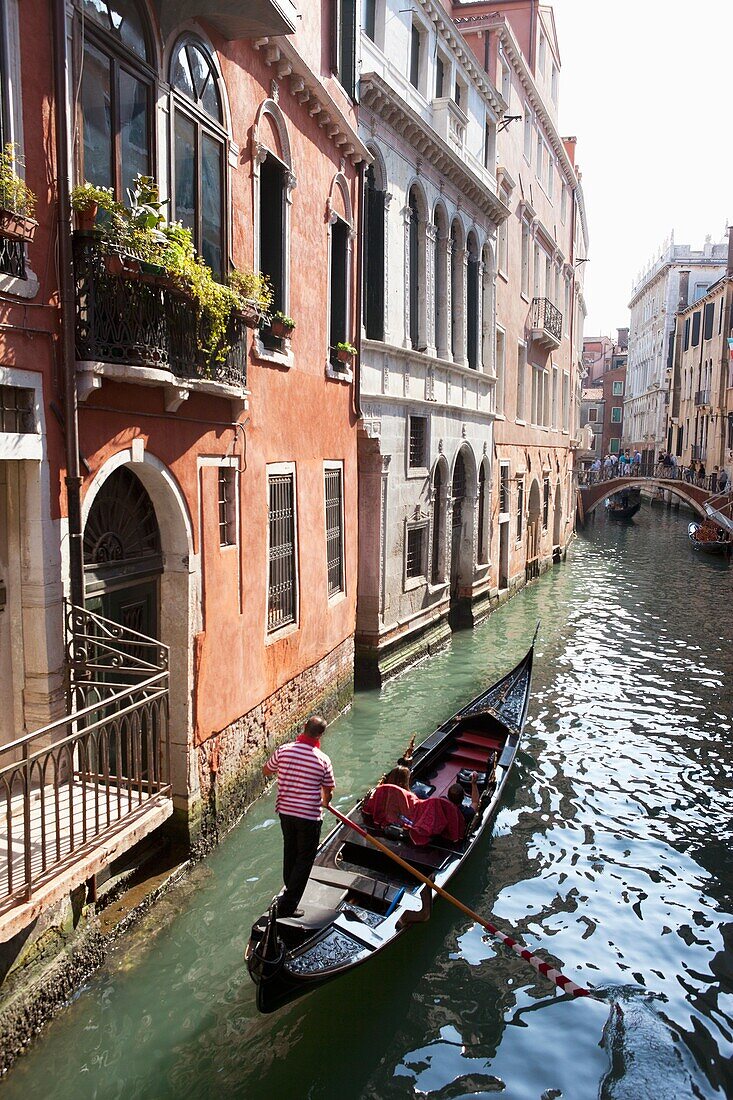 Gondolas on the narrow canals of Venice, Italy