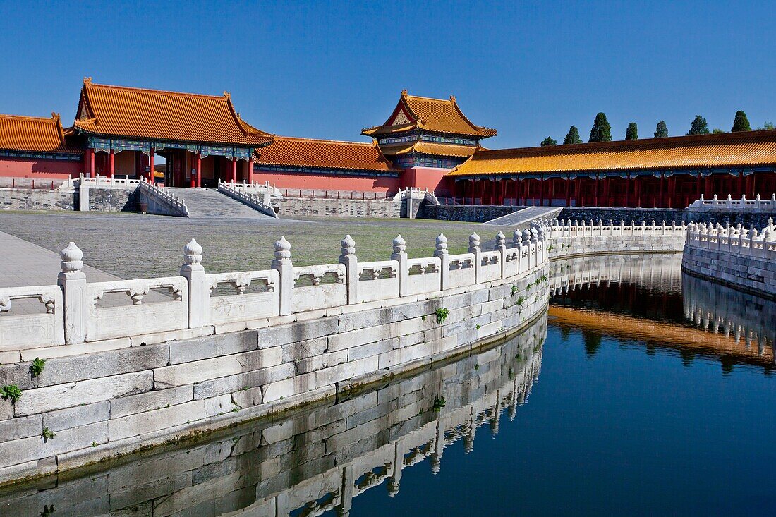 The calm waters of the canal with reflection in the Forbidden City, Beijing, China, Asia.