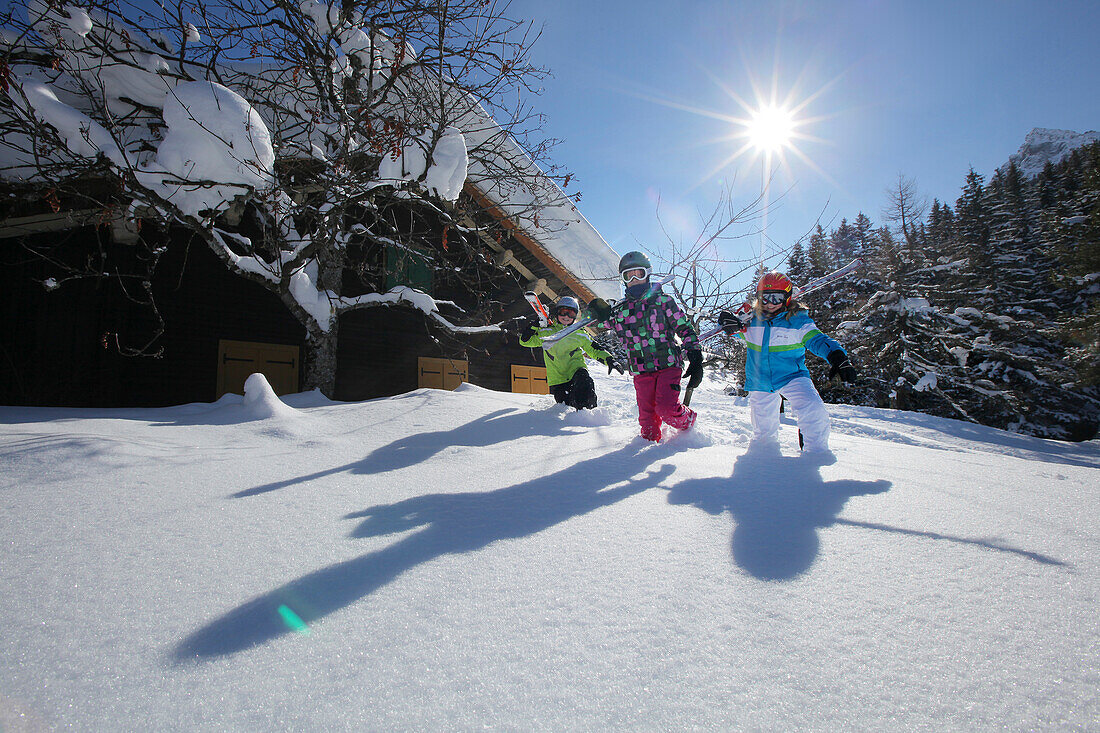 Children with skiing equipment, Vergalden, Gargellen, Montafon, Vorarlberg, Austria