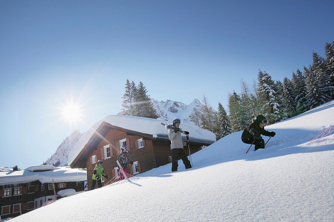 Family with ski, Gargellen, Montafon, Vorarlberg, Austria