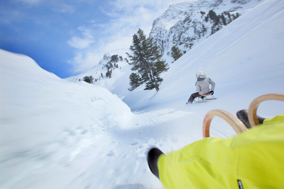 People sledding downhill, Kuehtai, Tyrol, Austria