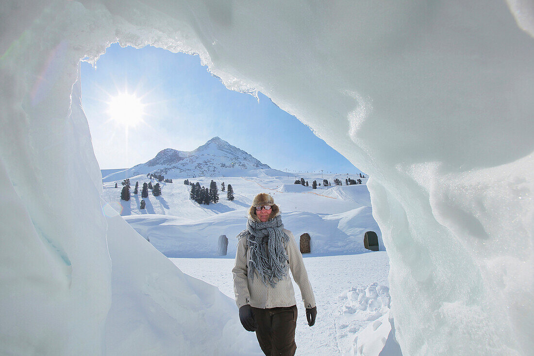 Woman in Iglu village, Hohe Mut in background, Kuehtai, Tyrol, Austria