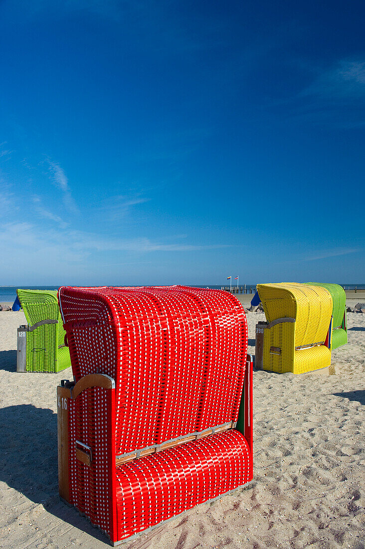 Colourful beachchairs under blue sky, Utersum, Foehr, North Frisian Islands, Schleswig-Holstein, Germany, Europe