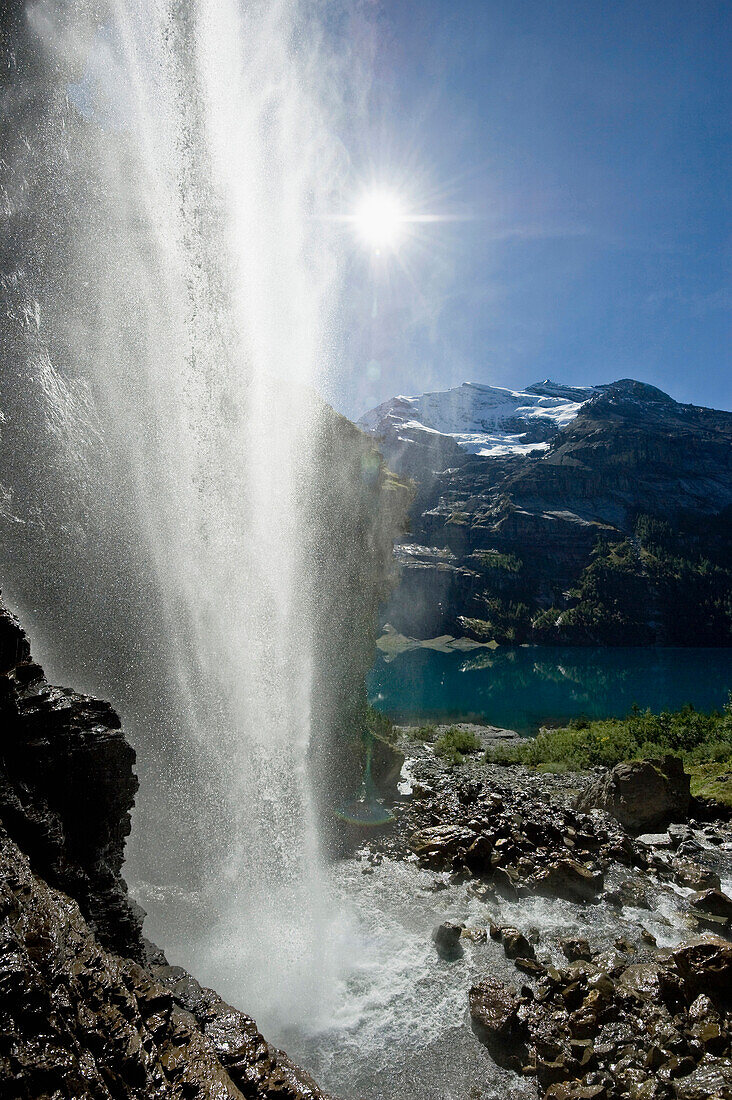 Waterfall at lake Oeschinensee, Kandersteg, Bernese Oberland, Canton of Bern, Switzerland, Europe