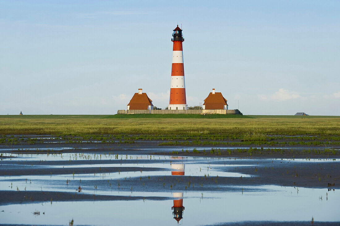 View over mudflats onto Westerheversand lighthouse, Westerhever, Wadden Sea National Park, Eiderstedt peninsula, North Frisian Islands, Schleswig-Holstein, Germany, Europe