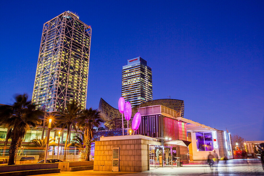 Arts Hotel and Tower Mapfre at night in Barcelona, Spain