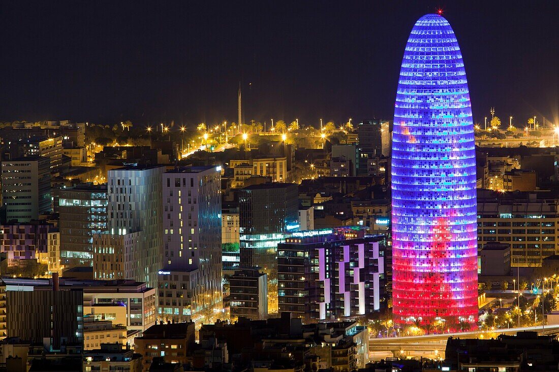 Agbar building at night in Barcelona city, Spain