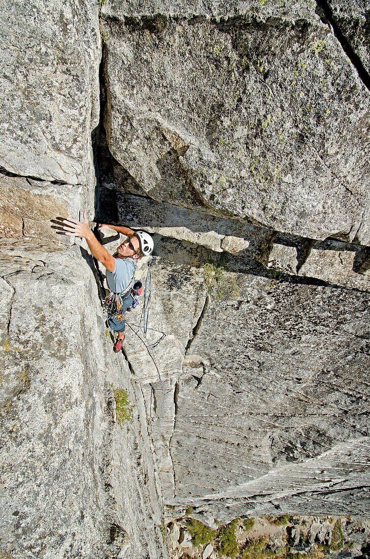 Andrew Stone rock climbing a route called Corrugation Corner which is rated 5,7 and located at Lovers Leap near Lake Tahoe in northern California