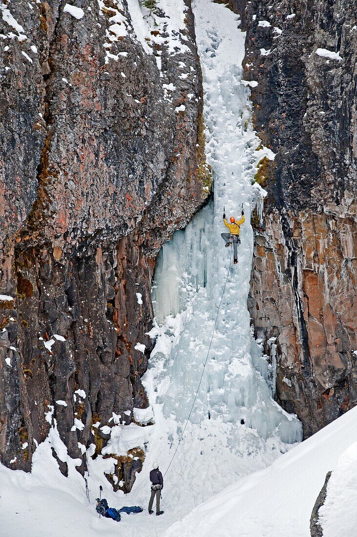 Elijah Weber ice climbing a route called The Elevator Shaft which is rated WI-4 and located at the Unnamed Wall in Hyalite Canyon near the city of Bozeman in southern Montana