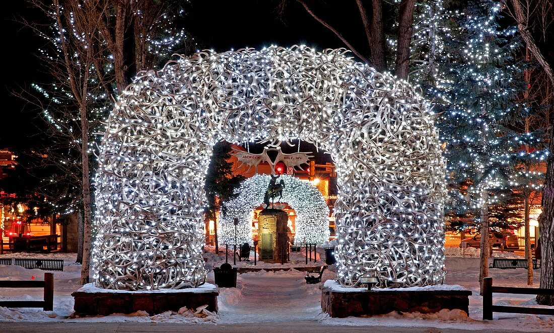 Tetons, lights on the Elk antler arches at the town square in the city of Jackson in northern Wyoming