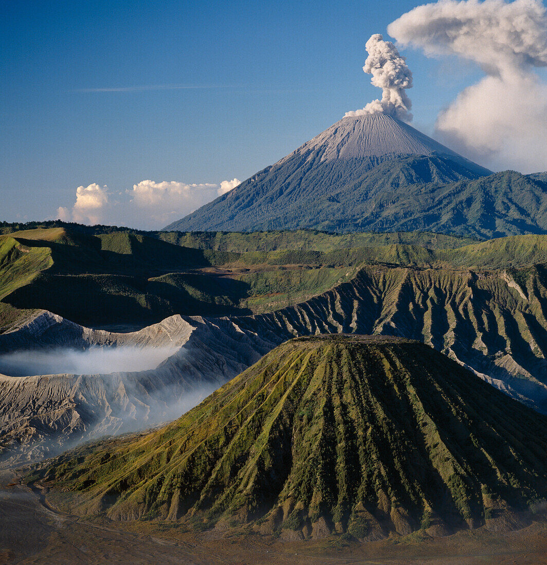 Mount Semeru erupting in 1989, Viewed from ancient Tengger, Caldera Bromo active crater on the left, East Java, Indonesia