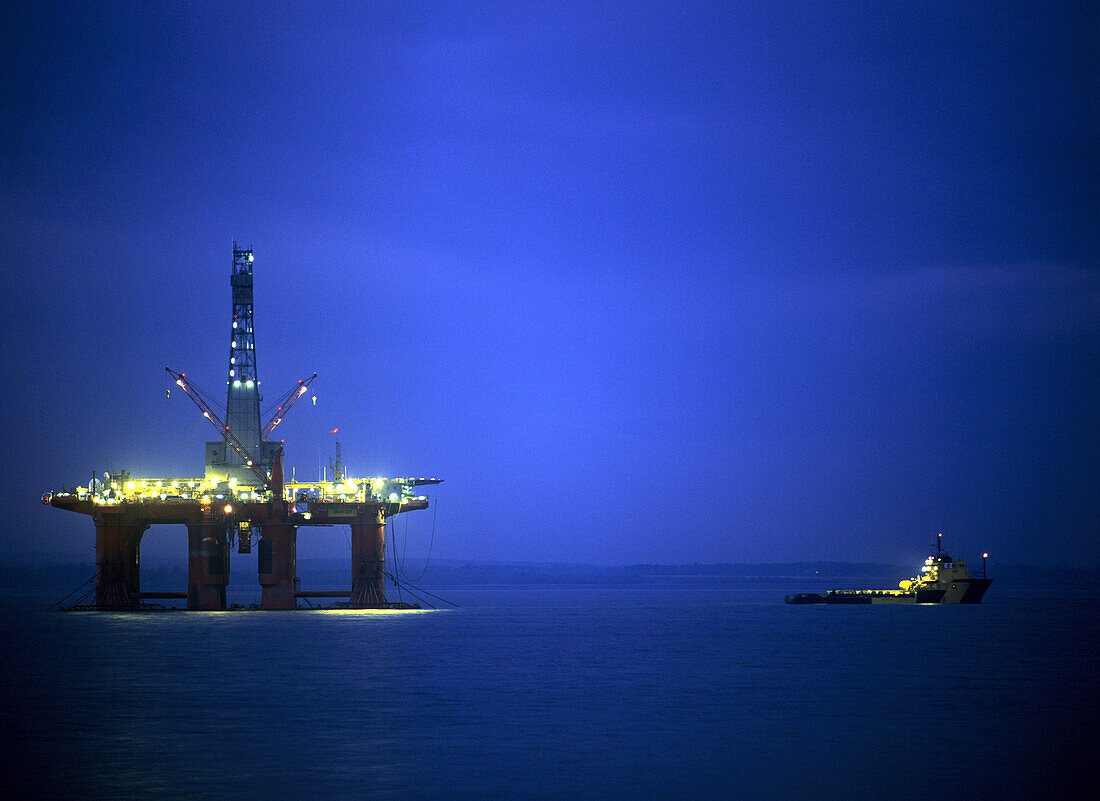 Oil drilling platform at night, Scotland