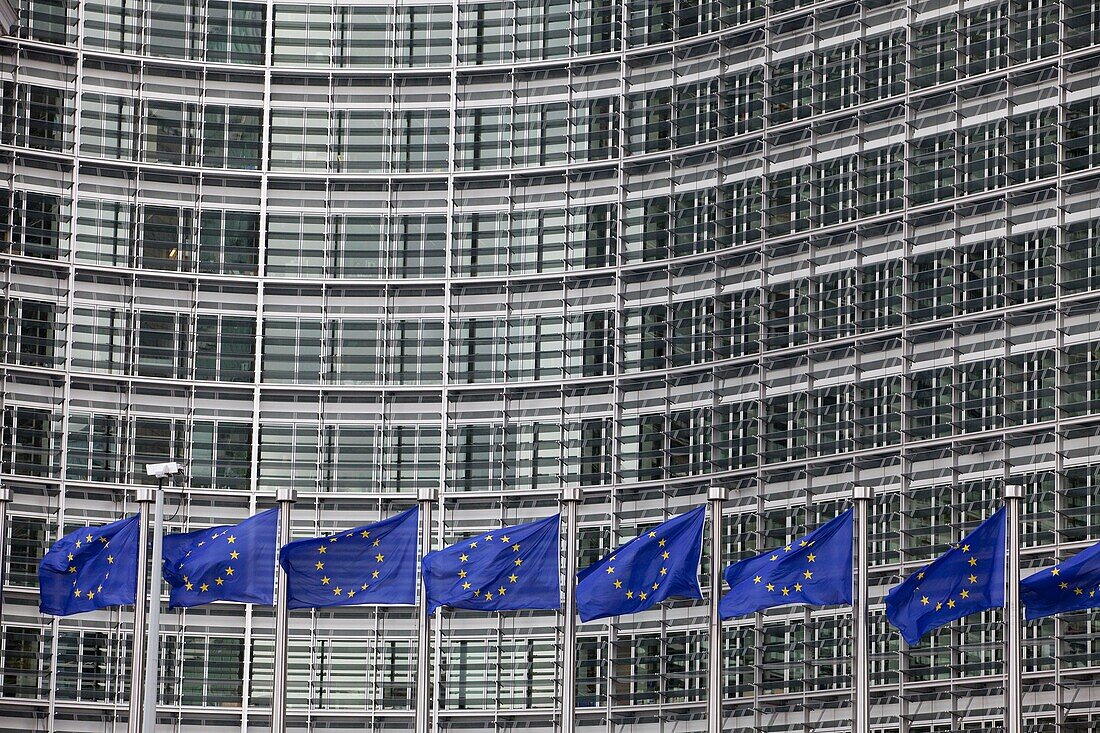 Flags wave outside the European Commission headquarters in Brussels, Belgium