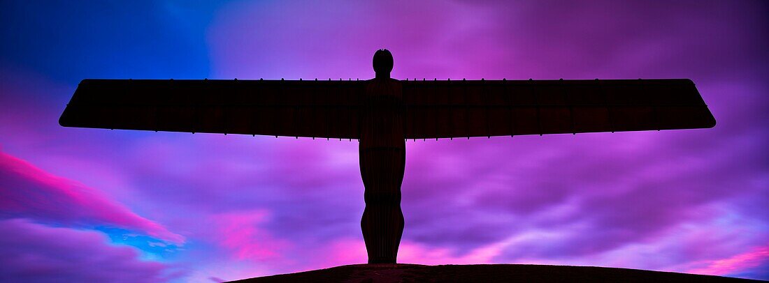 England, Tyne and Wear, Gateshead  The iconic Angel of the North statue by Antony Gormley, silhouetted against an atmospheric sky  The ´Angel´, built on a a former colliery pit head bath site, is one of the worlds most viewed work of art with over 33 mill