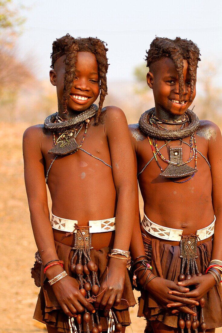 Himba boys brothers, with the typical plait hairstyle, Kaokoland, Kunene region, Namibia