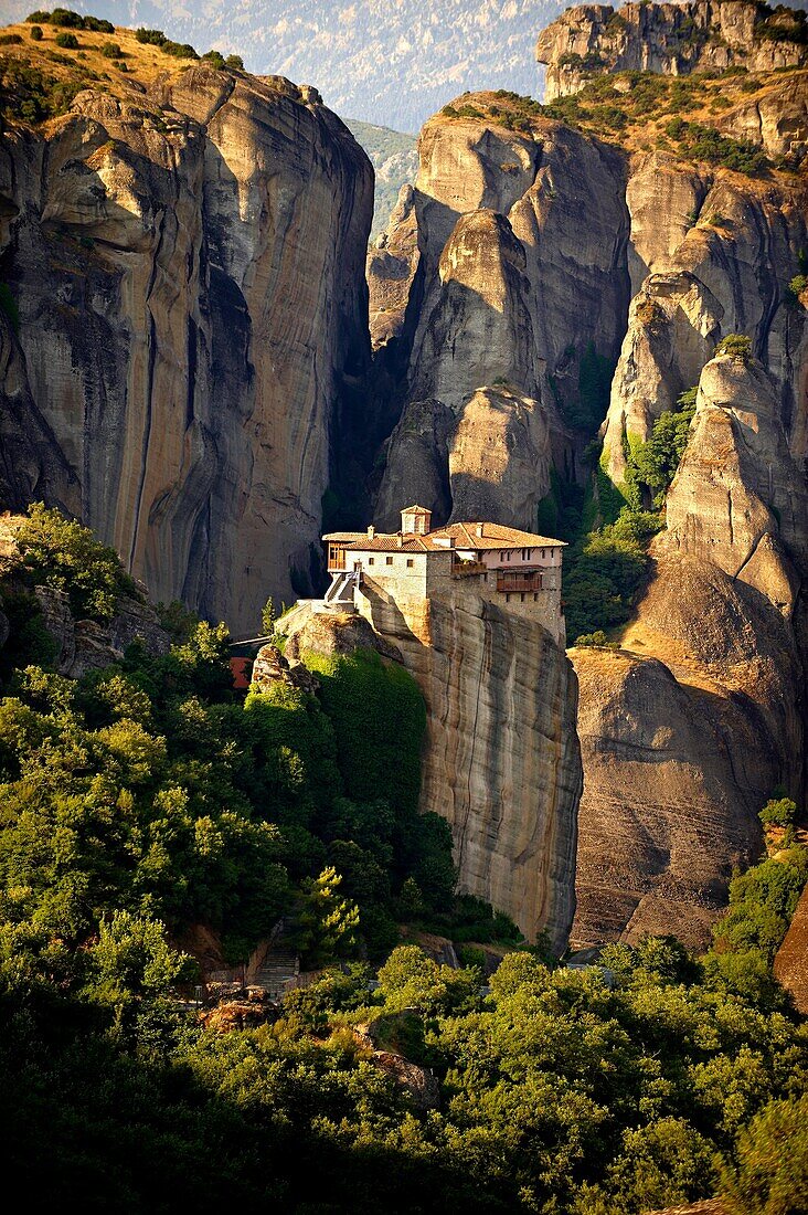 Greek Orthodox Rosanou Monastery Front and Monastery of St Nicholas Anapafsas background, Meteora Mountains, Greece