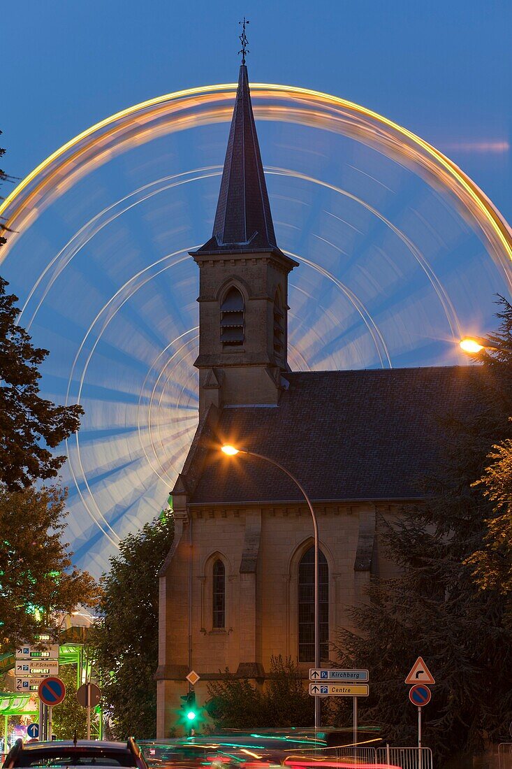 church and Ferris wheel at night, Luxembourg