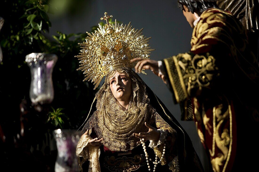 The image of Nuestra Señora de los Desamparados virgin is displayed by the Penas de Santiago brotherhood during an Easter Holy Week procession in Cordoba, Andalusia, Spain, April 17, 2011