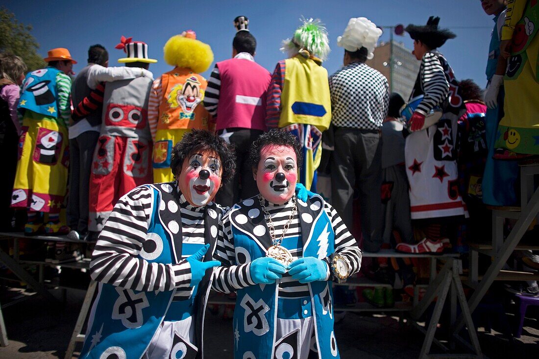 Twin clowns pose for a picture during the 16th International Clown Convention: The Laughter Fair organized by the Latino Clown Brotherhood, in Mexico City, October 17, 2011