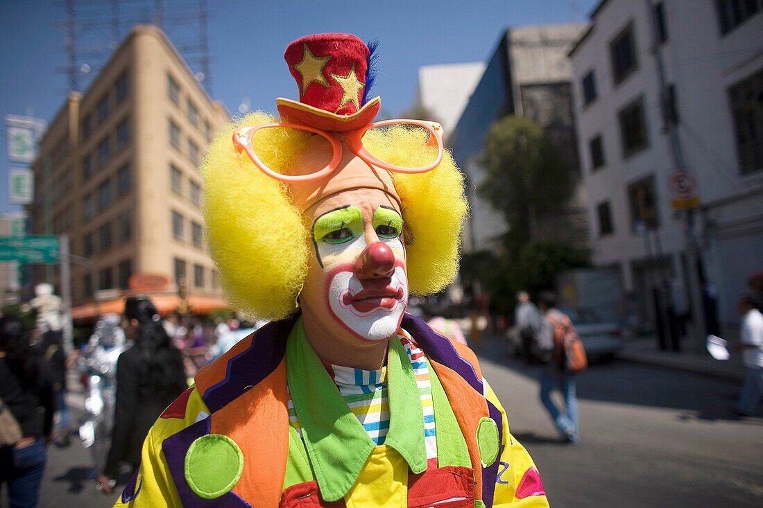 A clown walks in a parade during the 16th International Clown Convention: The Laughter Fair organized by the Latino Clown Brotherhood, in Mexico City, October 17, 2011