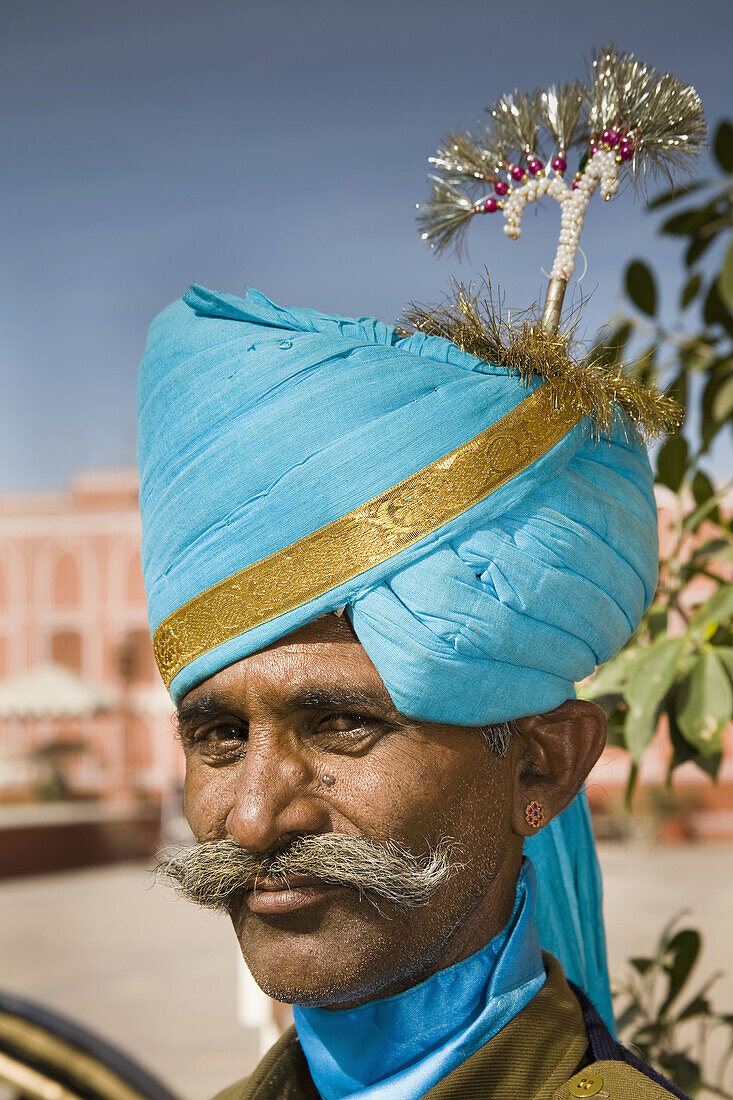 Man wearing traditional costume, City Palace, Jaipur, Rajasthan, India