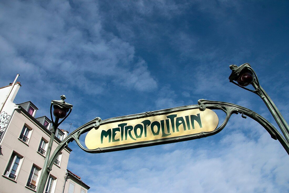 Paris, Metropolitan, building and art nouveau style subway sign
