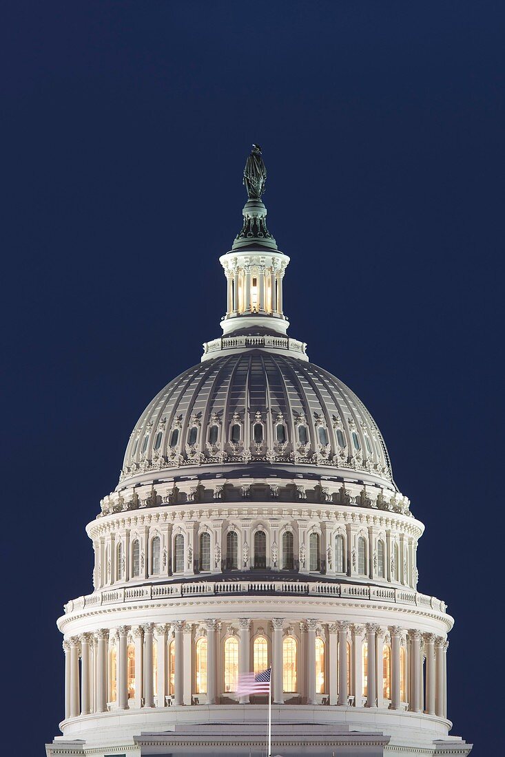 Lights illuminate the US Capitol Building after sunset in Washington DC, USA
