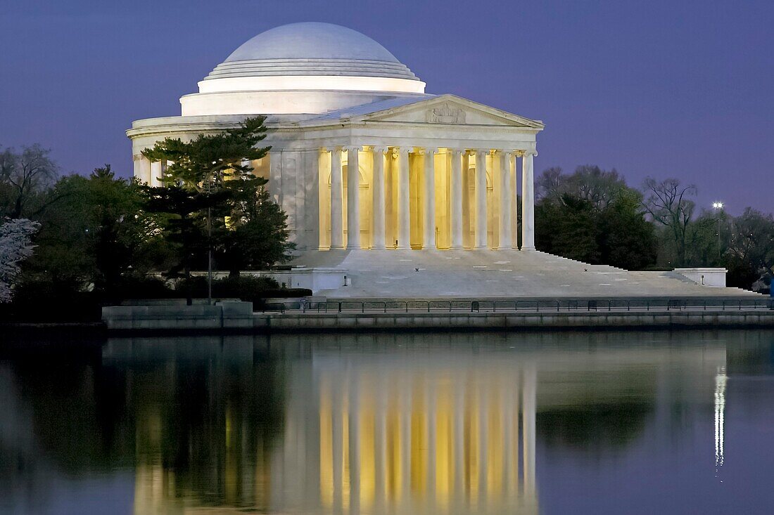 The Jefferson Memorial illuminated before sunrise on the Tidal Basin in Washington, DC, USA