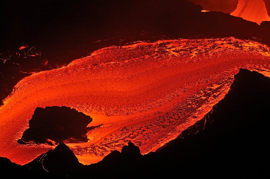 River of molten lava flowing to the sea at sunrise, Kilauea Volcano, Big Island, Hawaii Islands, Usa